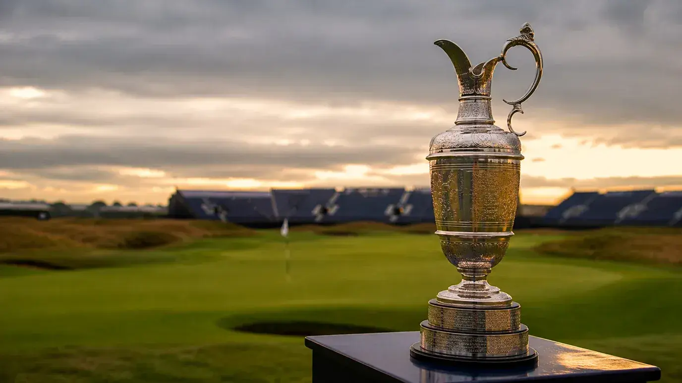 The Claret Jug trophy on display beside the 18th green at The Open Championship